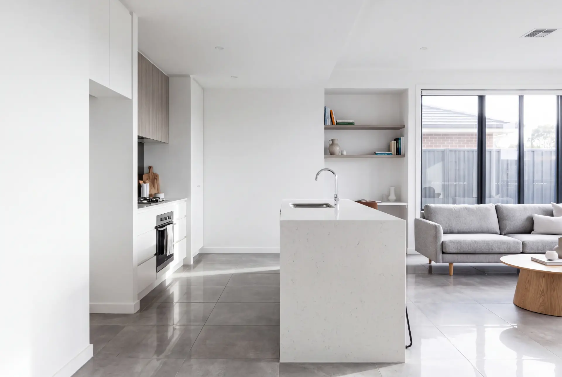 Bright modern kitchen and living space after a professional clean