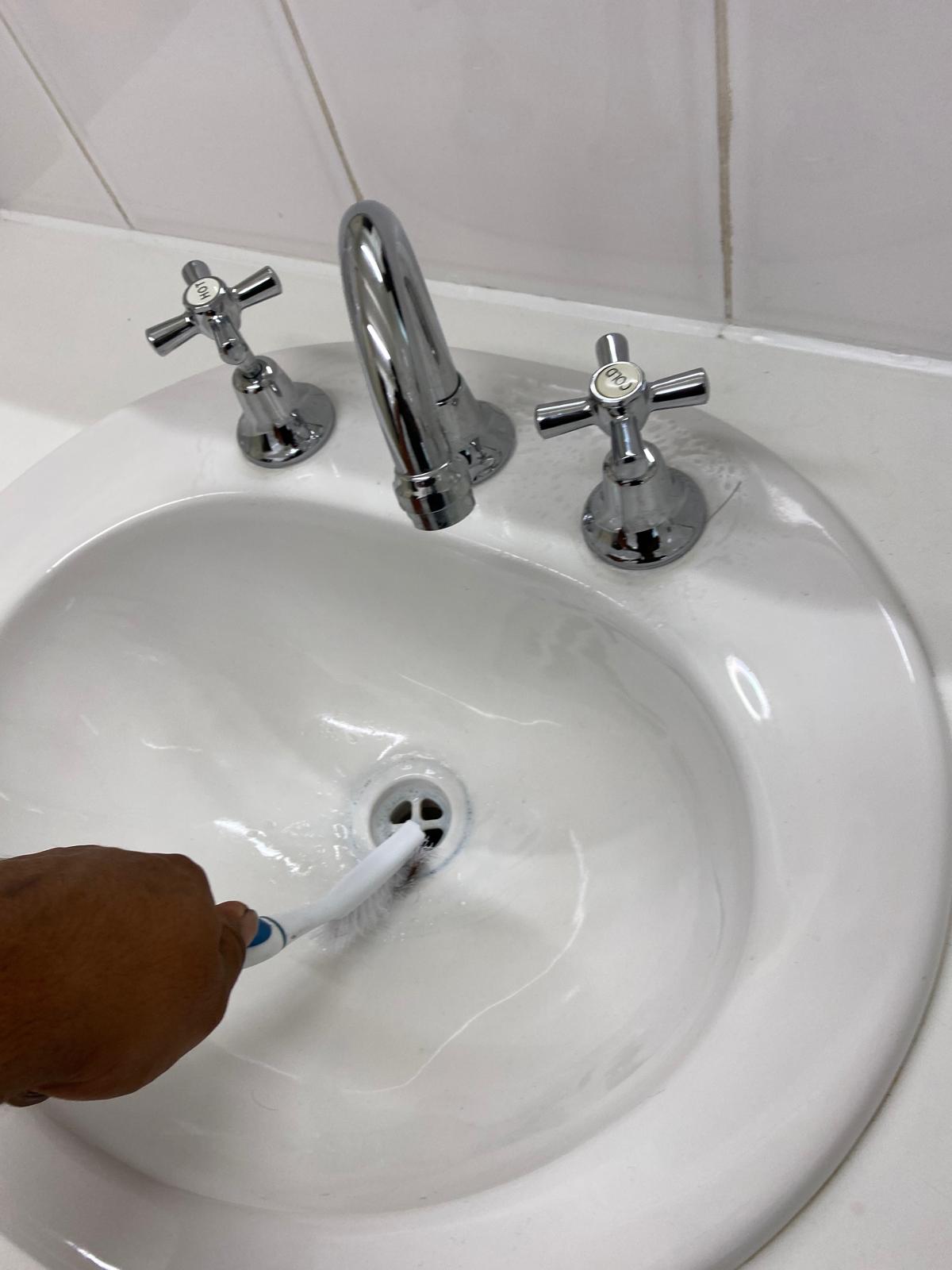 Bathroom basin and tap cleaning detail